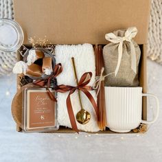 an open box containing coffee, tea and other items