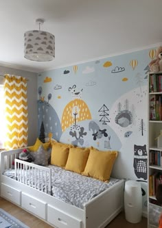 a child's bedroom decorated in yellow and gray