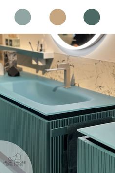 a bathroom with a sink, mirror and counter top in green color scheme on the wall