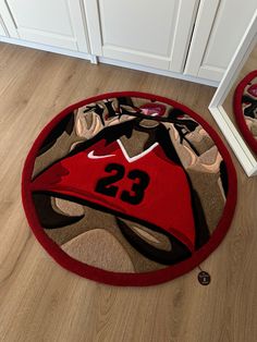 a red basketball jersey rug with the number 23 on it