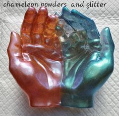 two hand - shaped soaps are sitting on a towel with the words chamelon powderers and glitter