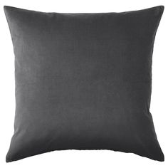 a dark gray pillow on a white background