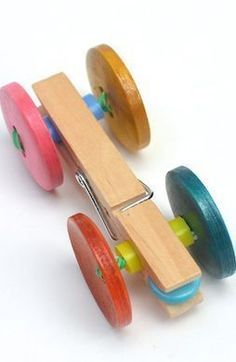 a toy car made out of wooden wheels