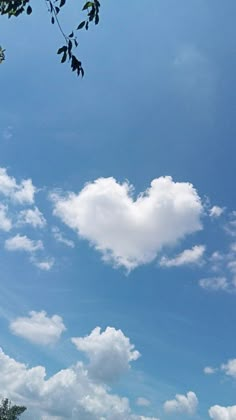 there is a heart shaped cloud in the sky