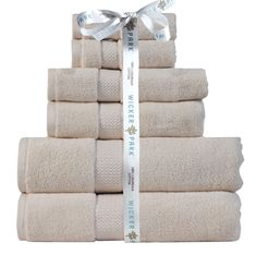 a stack of towels with a ribbon tied around it