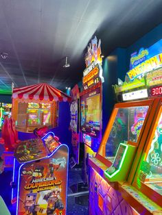 several arcade machines in a brightly lit room