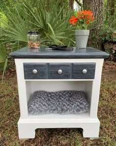 an old dresser turned into a dog bed