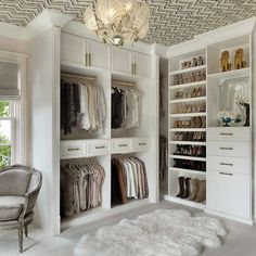 a walk in closet filled with lots of white furniture and shoes on top of shelves