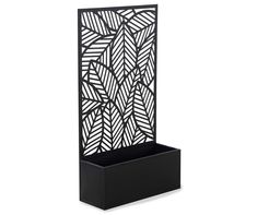 a black planter with an intricate design on it