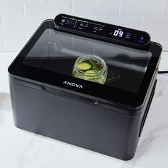 an oven sitting on top of a white counter