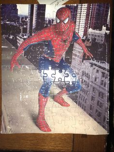 a puzzle with the image of spiderman on it