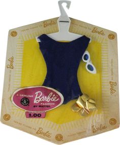 a blue and yellow bathing suit with eyeballs on it's head, hanging from a hook