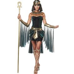 an egyptian woman dressed in costume and holding a staff