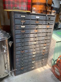 an old metal filing cabinet with many drawers