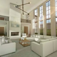 a large living room with white couches and windows