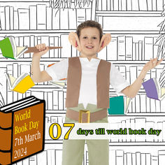 a young boy is standing in front of bookshelves and holding his hands up