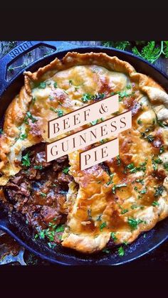 beef and guinness pie in a cast iron skillet with the words beef & guinness written on it