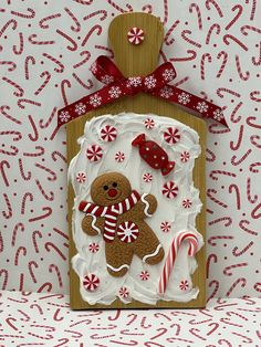 a gingerbread house is decorated with candy canes