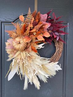 Welcome the beauty of autumn to your doorstep with our exquisite Earth Toned Ombré Fall Wreath!  Handcrafted wit care, this stunning wreath features a harmonious blend of rich burgundy, warm beige, vibrant burnt orange, and delicate pampas grass.  Adorned with carefully selected natural fall foliage, each wreath is a unique masterpiece that captures the essence of the season. Whether you're embracing the cozy vibes of fall or looking for a charming gift, our wreath is the perfect choice. Elevate your home's curb appeal, create a warm ambiance, and showcase your love for handmade craftsmanship.  Wreath Details: Earthy ombré design with burgundy, beige, burnt orange, and pampas grass Handcrafted with passion and expertise Natural fall foliage for an authentic touch Ideal for front doors, ent Pampas Grass Wreath Diy, Orange Christmas Decor, Pampas Wreath, Fall Ombre, Grass Wreath, Fall Wreath For Front Door, Foliage Wreath, Orange Christmas, Fall Stuff