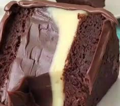 a piece of chocolate cake with white frosting