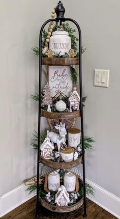 a shelf with christmas decorations and candles on it