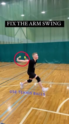 a man running across a basketball court holding a tennis racquet