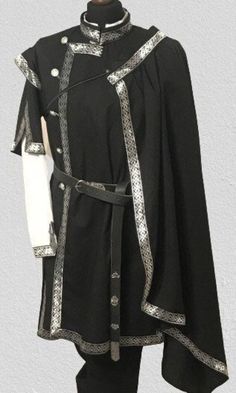 Cape with trim on the side and a thin leather belt with a metal clip to bind. The pattern of the trim may differ from the photo! You can choose silver or gold trim colors. Made with 100% cotton material Please note that above 90 kg/200 lbs for women and above 120 kg/260 lbs for men our products are made with an extra fee. Please order this listing as an addition: https://www.etsy.com/listing/1562690891/extra-cost-for-extra-size-production?click_key=8094f62d573a9ac48333de812216d36c4cc4ac02%3A1562 Midevil Mens Clothes, Fantasy Shoulder Cape, Space Captain Outfit, Medieval Spain Clothing, Royal Robes King, Black Elven Medieval Dress For Festivals, Black Elven Medieval Dress For Medieval Festivals, Knightcore Aesthetic Fashion, Medieval Outfit Women Warriors