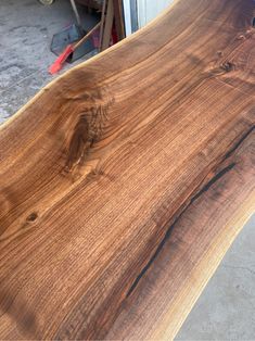 a close up of a wooden table with wood grain on the top and bottom edge