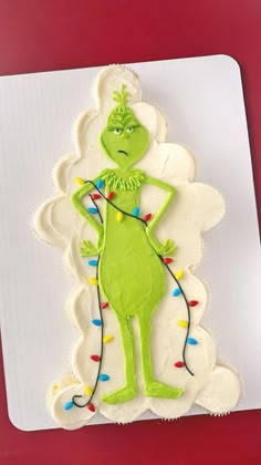 the grinch cookie is decorated with icing and lights