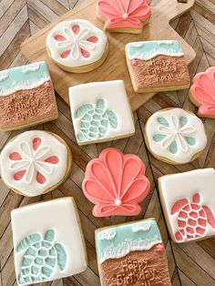 some decorated cookies are on a wooden table