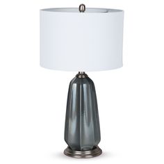 a table lamp with a white shade on it's base and a silver finish