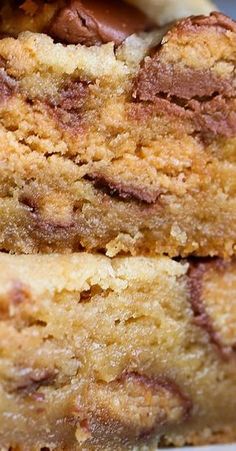 two pieces of cake sitting on top of a white plate