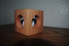 a wooden speaker sitting on top of a table