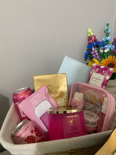 a basket filled with lots of different types of cosmetics and personal care items in it