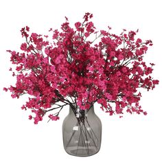 a vase filled with pink flowers on top of a table