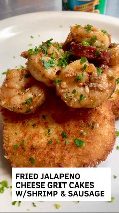 fried jalapeno cheese grit cakes with shrimp and sausage on a white plate