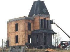 a house being built on top of a hill