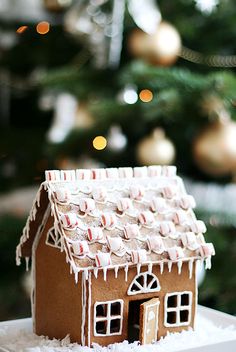 a small gingerbread house on top of a table