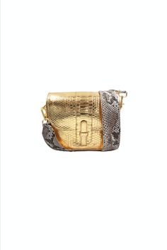 This one-of-a-kind bag fits everything comes with hooks to attach an optional strap. Detailed with a concealed magnetic closure, interior slip pocket, and fully lined. Made in Italy from responsibly sourced Python. Color: Metallic Gold Composition: Python Width: 8.8"Height: 7.7"Depth: 3" *A portion of the proceeds of the sale of this bag will benefit the Fish & Wildlife Foundation of Florida. "The Kara bag is one of my favorite everyday bags. With a modern twist on my traditional python strap, this unconventional style adds an edge to any casual outfit." XK Elegant Travel Satchel With Cell Phone Pocket, Elegant Satchel With Cell Phone Pocket, Elegant On-the-go Satchel With Cell Phone Pocket, Luxury Square Shoulder Bag For On-the-go, Luxury Clutch Shoulder Bag For On-the-go, Luxury Square Satchel For On-the-go, Luxury Rectangular Flap Bag For On-the-go, Luxury Rectangular Flap Bag, Designer Rectangular Wallets With Mobile Phone Bag