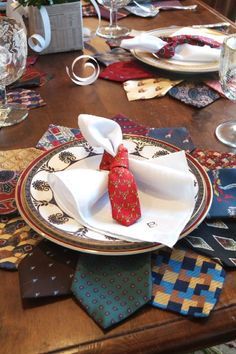 the table is set with ties and napkins