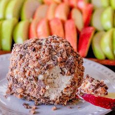 a dessert is on a plate with apples in the background