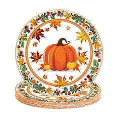 a plate with a pumpkin on it and leaves around the edge, in front of a white background