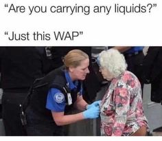 an older woman in scrubs talking to a police officer who is wearing blue gloves