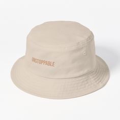 This packable, scrunchable, lightweight headwear classic is ready for adventure, from the beach to the street to the trail Breathable 100% cotton with eyelet ventilation Flat top Moderate brim is 2.2"" (5.5 cm) wide to keep the sun off your face Unstructured crown is 3.1"" (8 cm) deep Easy care: just spot clean and dry in shade. This "UNSTOPPABLE" bucket hat is for those who know no limits. Carry with you the unstoppable mindset in everything you do. Ideal for young individuals determined to ove Hats For Sale, Flats Top, The Trail, Bucket Hat, Crown, Sun, Hats