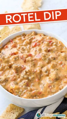 Close-up of creamy Rotel cheese dip with spicy sausage and Rotel tomatoes served in a white bowl, surrounded by tortilla chips on a marble surface. Best Rotel Dip With Sausage, Rotelle Recipes, Rotelle Dip, Cheese Dip Recipes Velveeta, Spicy Sausage Recipes, Rotel Dip With Sausage, Rotel Cheese, Rotel Cheese Dip, Chip Dip Recipes