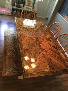 a wooden table with candles on top of it