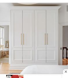 an image of a bedroom with white closets and wood floors in the room that is featured on instagram