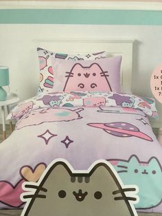 a bed with a cartoon cat on it