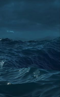 an image of the ocean at night with dark clouds and water in the foreground