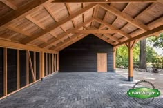 the inside of a building that has been constructed with wood and brick tiles on it